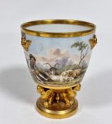 An early 19thc porcelain cachepot with beautifully enamelled landscape scenes, with goatherd and two