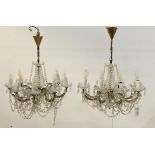 A pair of Venetian style cut glass and brass chandeliers, the central column issuing eight