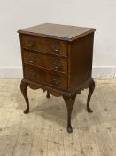 A mid 20th century mahogany bedside chest of George II design, the cross banded top three drawers,