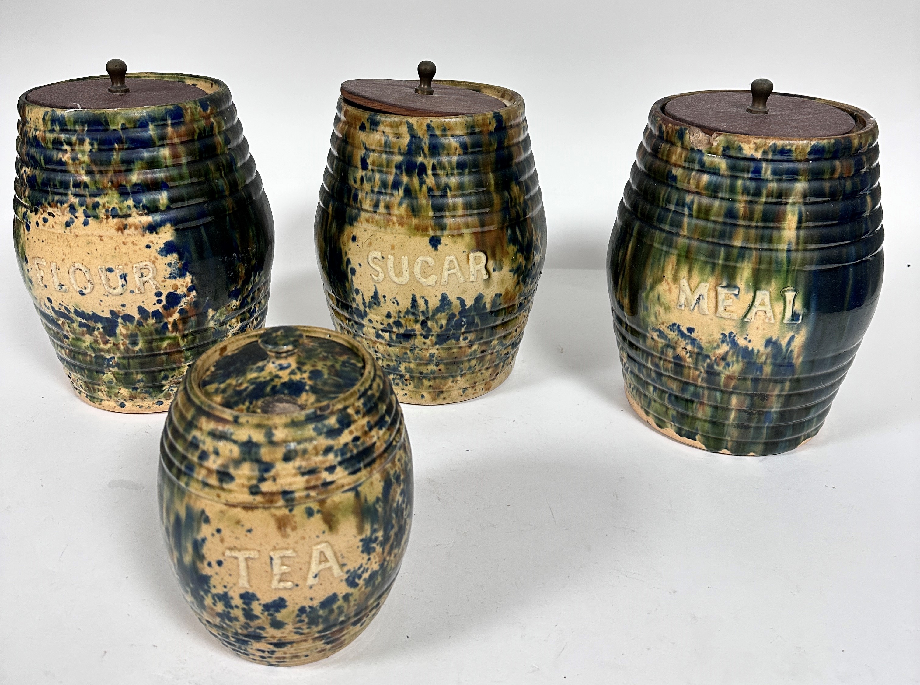 A set of four possibly Methven pottery ribbed barrel storage jars including meal, sugar, flour and