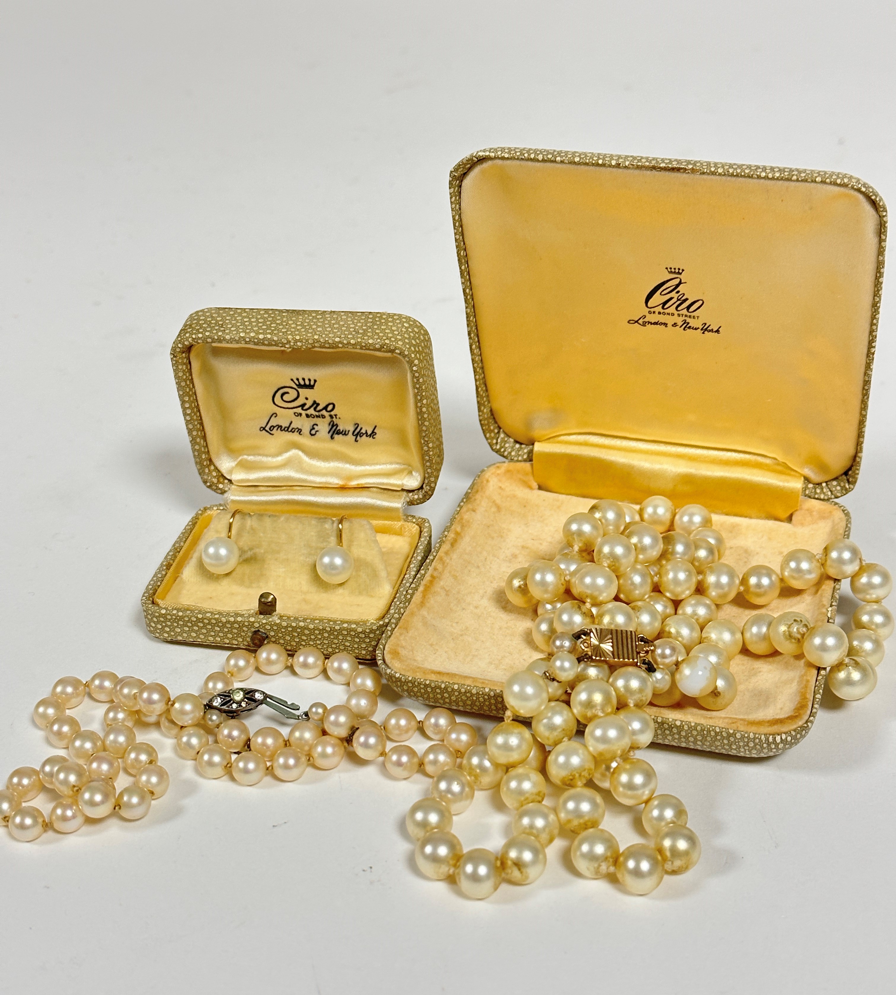 Vintage:- A pair of yellow metal mounted screw in paste pearl stud earrings and a paste pearl two
