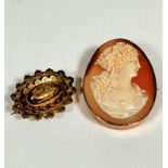 A 9ct gold oval carved shell cameo brooch with Grecian style carved portrait of a lady with grapes