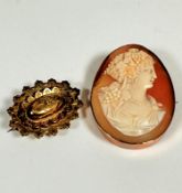 A 9ct gold oval carved shell cameo brooch with Grecian style carved portrait of a lady with grapes