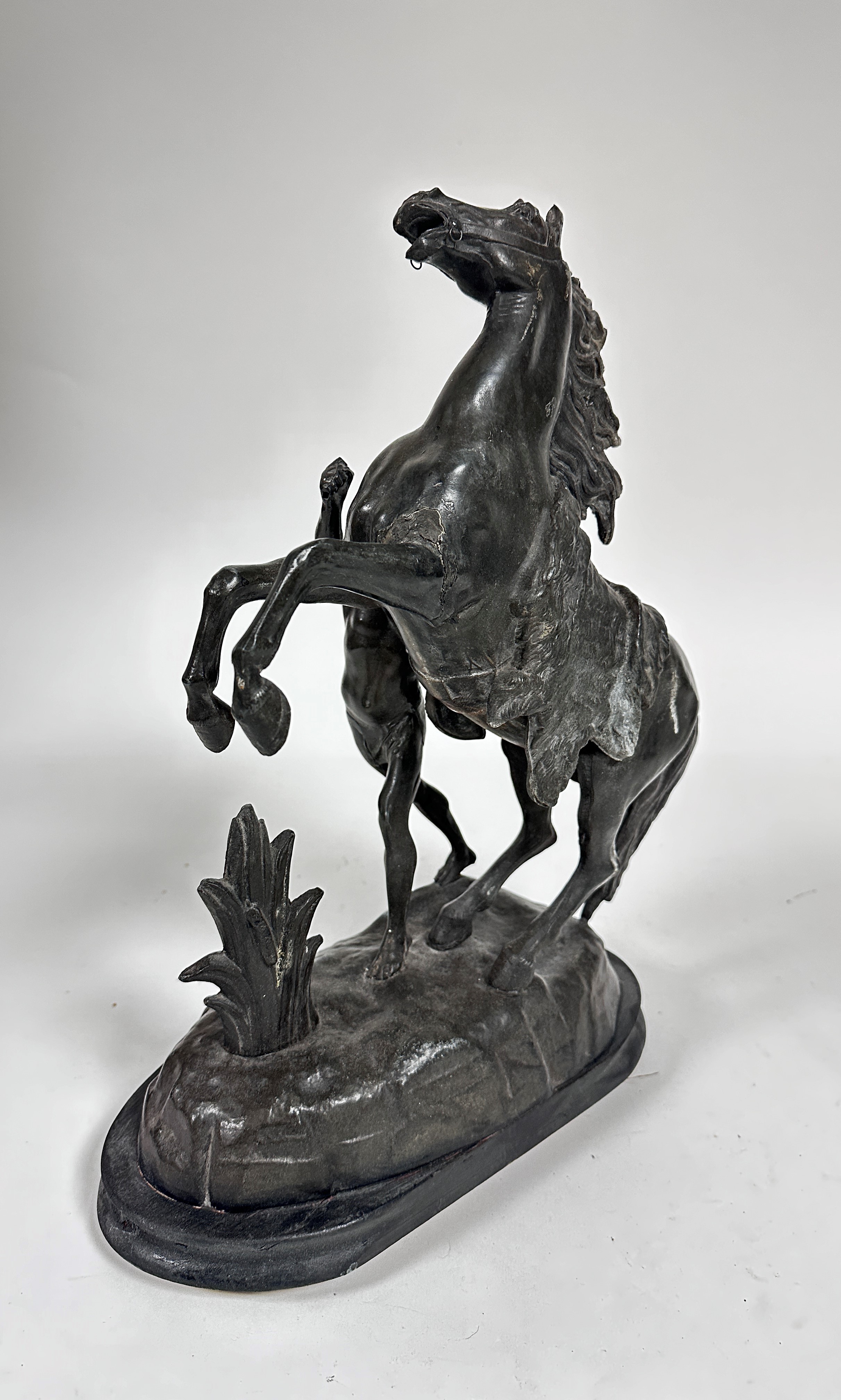 A cast spelter model of a Marley horse and Figure on oval moulded hardwood base (46cm x base: 32cm x - Image 2 of 3