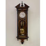 A Victorian figured walnut and ebonised Vienna regulator wall clock, the case of architectural