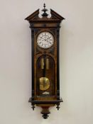 A Victorian figured walnut and ebonised Vienna regulator wall clock, the case of architectural