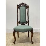 A well carved Victorian rosewood chair, the crest rail of scrolling form centred by a vacant
