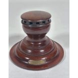 An Edwardian mahogany Capstan style inkwell, made from the timbers taken from HMS Britannia, with