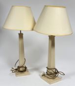 A pair of Oka cream coloured table lamps on a square tapered base. (h - 52cm)