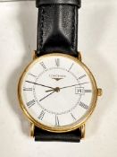 A gentleman's 18ct gold Longines wristwatch with gold bezel and enamelled dial, Roman numerals and