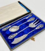 An Edwardian four piece condiment service including pickle fork, jam spoon, fish server fork and