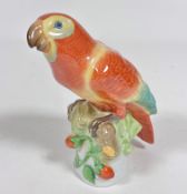 A Herend porcelain model of a Parakeet, decorated with feathered polychrome enamels (17cm x 14cm x