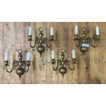 A set of four brass twin branch wall sconces H32cm