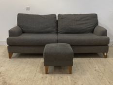A contemporary three seat sofa upholstered in grey, with bolster cushions (H96cm, L218cm, D102cm)