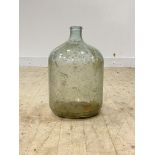 A large green glass demijohn, pontil mark to base, H49cm