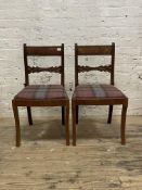 A pair of Edwardian mahogany side chairs, with reeded and gadrooned back over drop in seat pad,