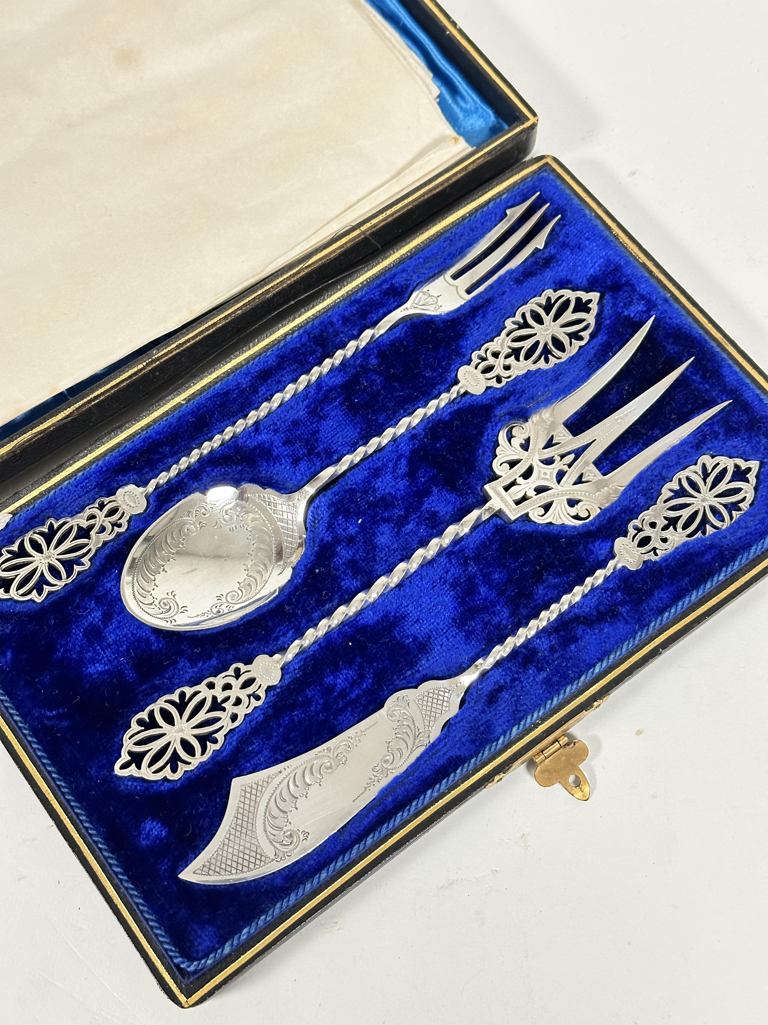 An Edwardian four piece condiment service including pickle fork, jam spoon, fish server fork and - Image 2 of 2