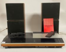 A Bang and Olufsen BEOCENTER 7007 record deck and pair of BEOVOX S45 speakers