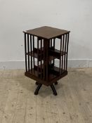 An Edwardian mahogany two tier revolving bookcase on a four point base, H75cm, 39cm x 39cm