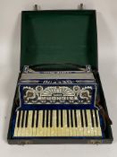 A Delfini Sicnora Italian accordion in hard case