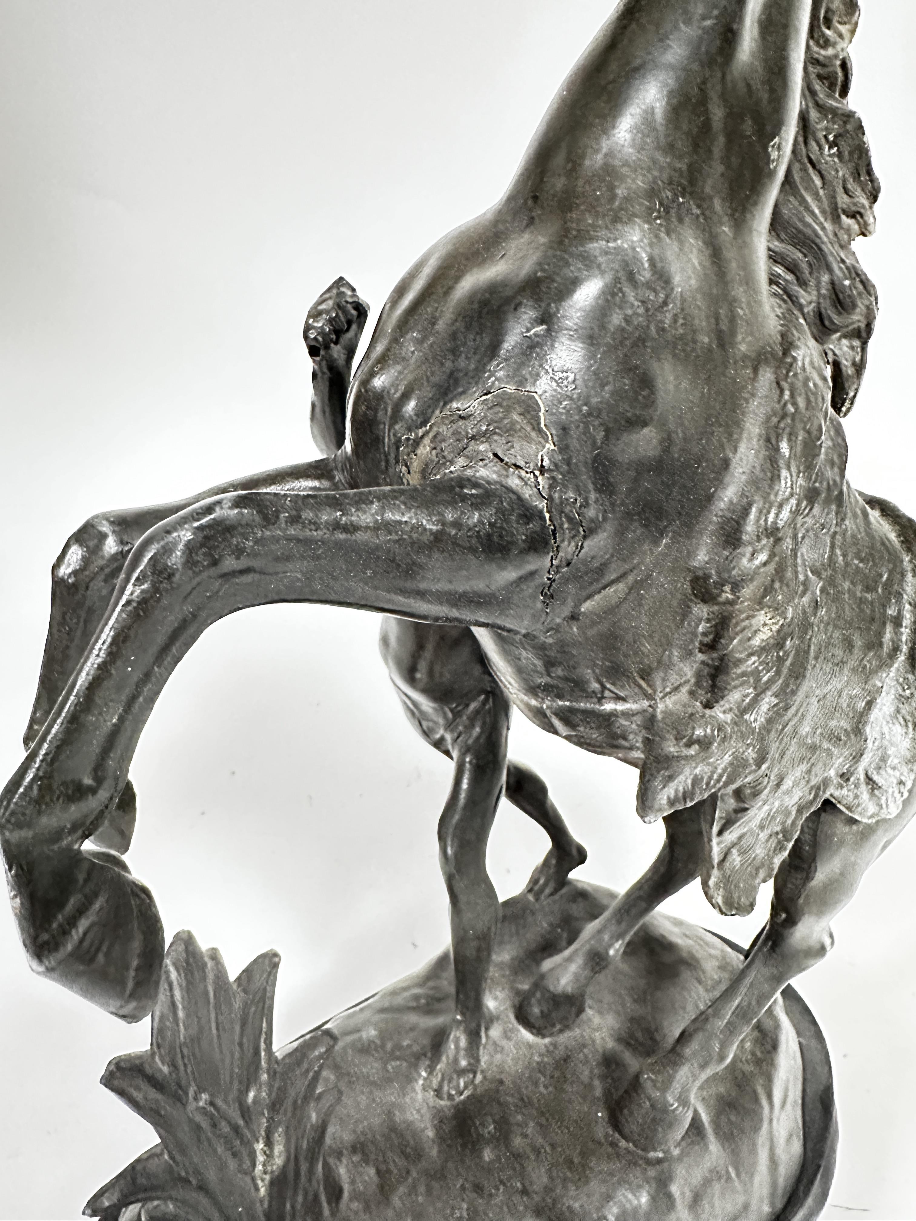 A cast spelter model of a Marley horse and Figure on oval moulded hardwood base (46cm x base: 32cm x - Image 3 of 3