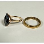 A 10ct gold obsidian navette shaped cut dress ring (2cm x 0.5cm) mounted in claw setting,