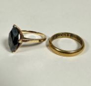 A 10ct gold obsidian navette shaped cut dress ring (2cm x 0.5cm) mounted in claw setting,