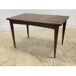 A mid century teak extending dining table, the square cross banded top with duo drawer leaf raised