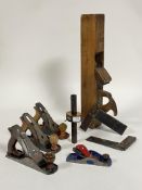 Vintage tools, an ebony and brass mounted joiners scribe, two rosewood and brass mounted squares,