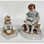 A Zsolnay Pecs porcelain figure of a Child Squatting with Ball, decorated with polychrome enamels,