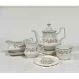 A Johnson Brothers Eternal Beau, part tea service with flora ribbon design and green gilding,