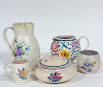 A Poole pottery baluster jug decorated with roses, cornflowers etc with C scroll handle to side, (