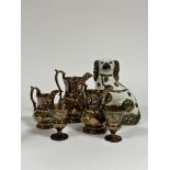 A group of lustreware comprising a pair of wine glasses (h -10cm) decorated with a band of green