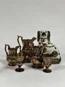 A group of lustreware comprising a pair of wine glasses (h -10cm) decorated with a band of green