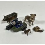 A Dinky die cast metal motorbike rider with side car, a cold painted metal miniature French bull