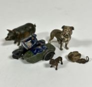 A Dinky die cast metal motorbike rider with side car, a cold painted metal miniature French bull