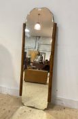 An Art Deco period walnut framed wall hanging mirror, the bevelled plate with serpentine edge