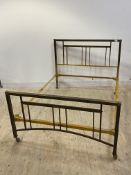 An early to mid 20th century square section brass framed 4'6" double bed, the frame with applied