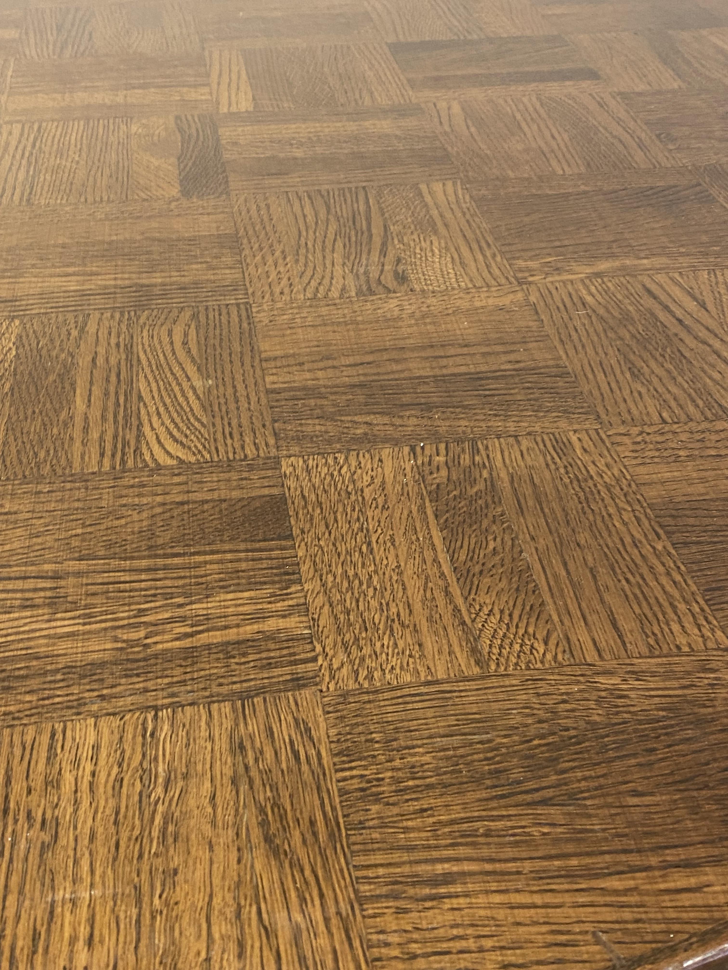 A stained oak and beech centre or dining table, late 20th century, the circular parquetry top raised - Image 2 of 2