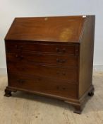 A George III mahogany bureau, the fall front revealing well fitted interior, over four graduated