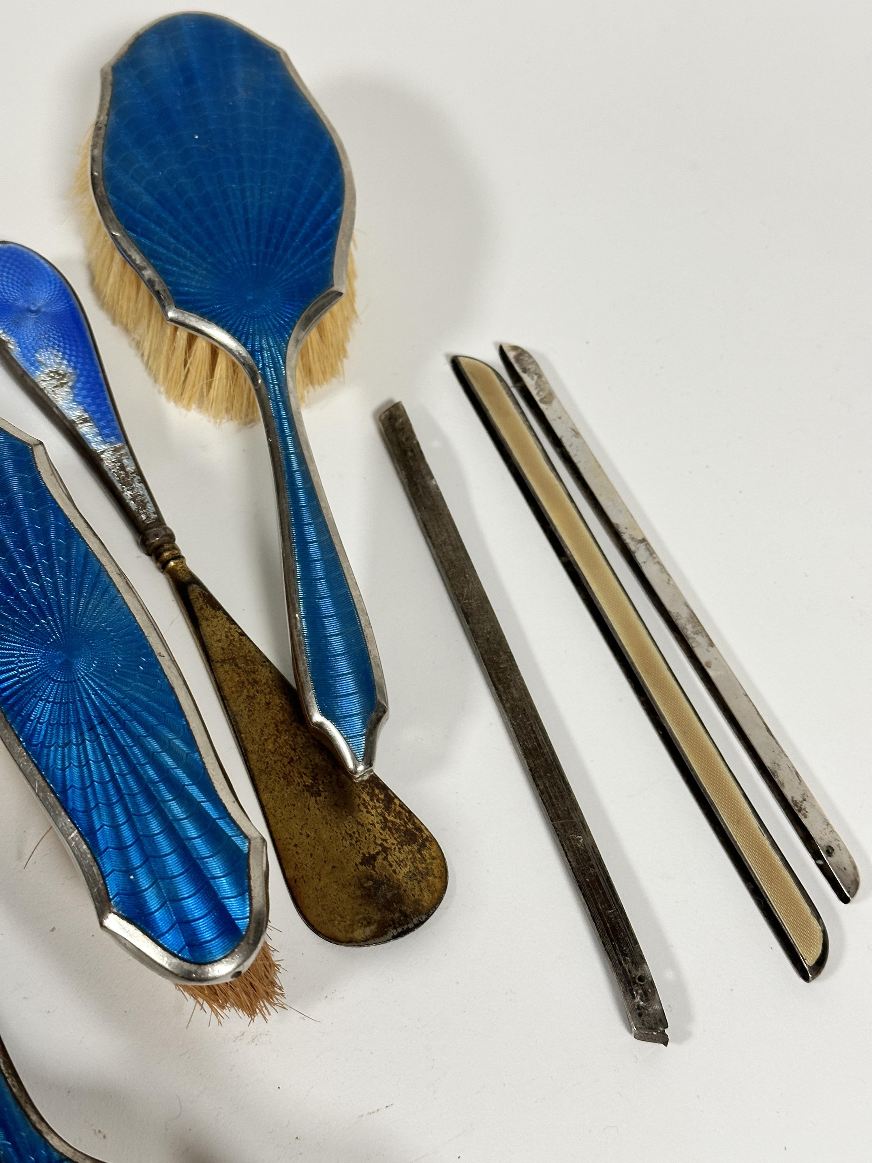 A six piece blue guilloche style enamelled silvered dressing table brush set, an Edwardian silver - Image 4 of 4