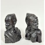 A pair of carved African Nigerian ebony busts of a male and female, (h 23cm)