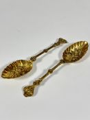 A pair of 19thc gilt metal leaf shaped chased berry spoons, (L 21cm)