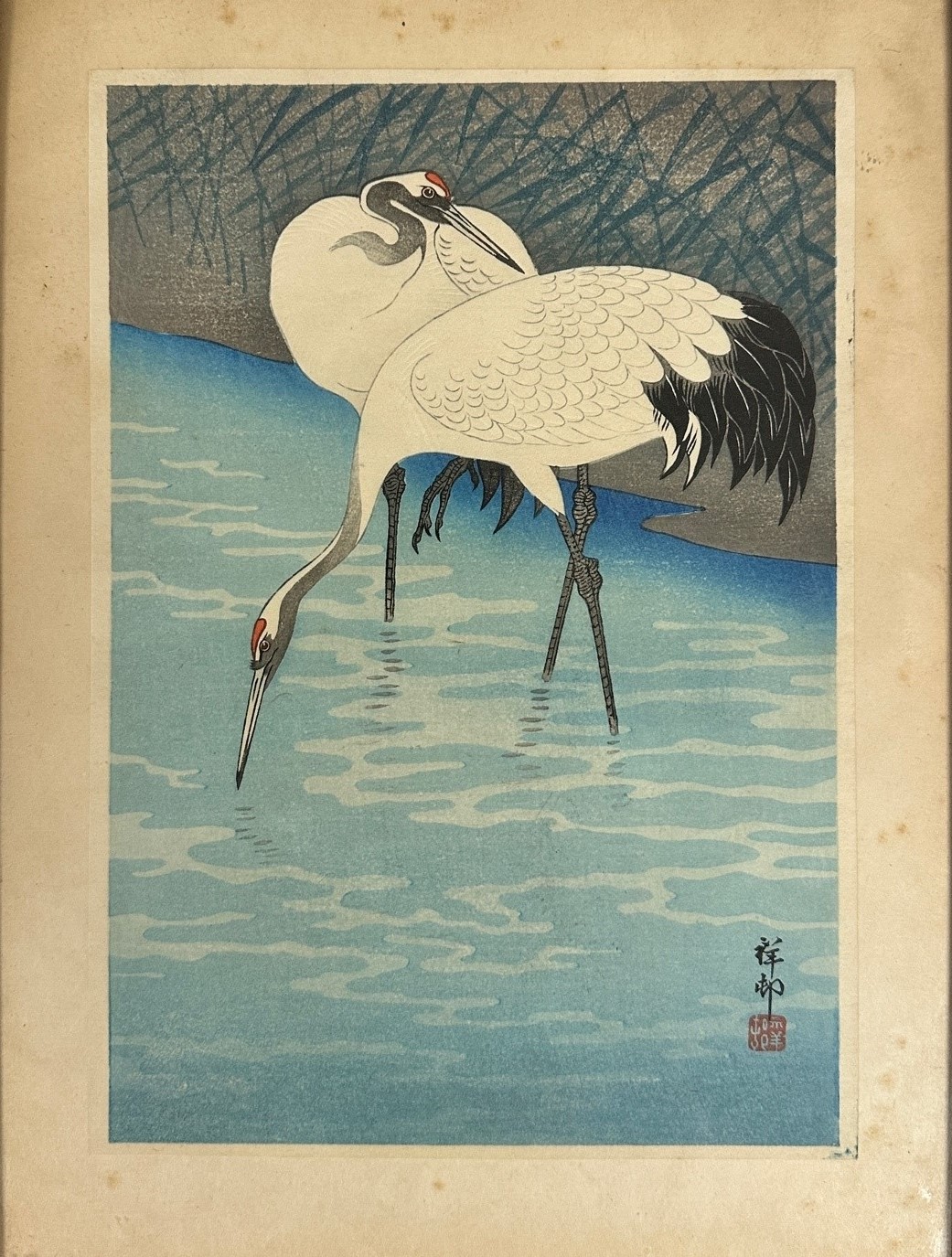 19thc Japanese wood block print depicting Two Cranes at River Edge, highlighted with colour,