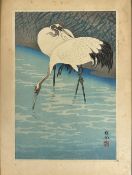 19thc Japanese wood block print depicting Two Cranes at River Edge, highlighted with colour,