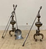 A pair of steel andirons, on scrolling front supports (H51cm) together with a matching fire guard,