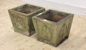 A pair of reconstituted stone planters of square tapered form with Prince of Wales feather motif