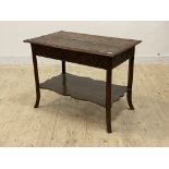 An early 20th century carved oak two tier side table, H68cm, W91cm, D55cm