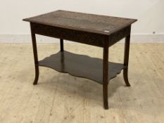 An early 20th century carved oak two tier side table, H68cm, W91cm, D55cm