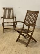 A pair of slatted teak folding garden chairs H99cm